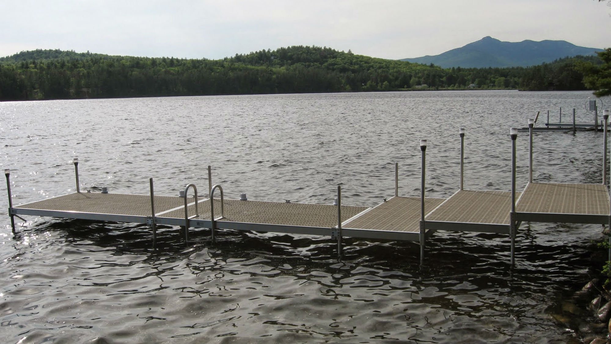 a metal dock on a lake