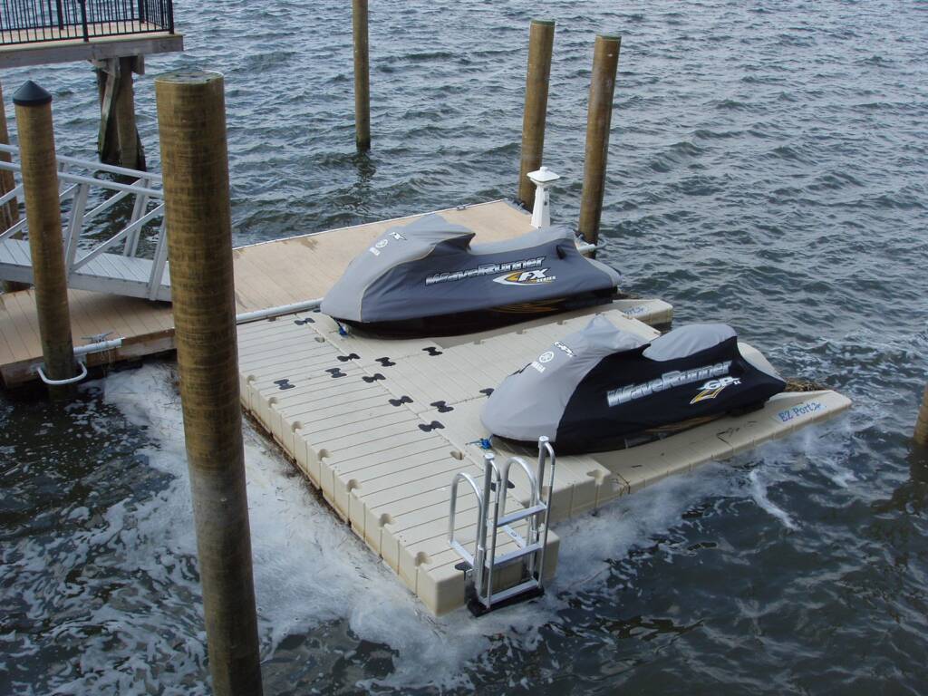 two jetskis docked out of water