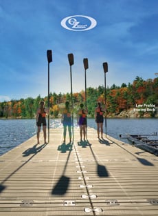 four people carrying rows on a dock
