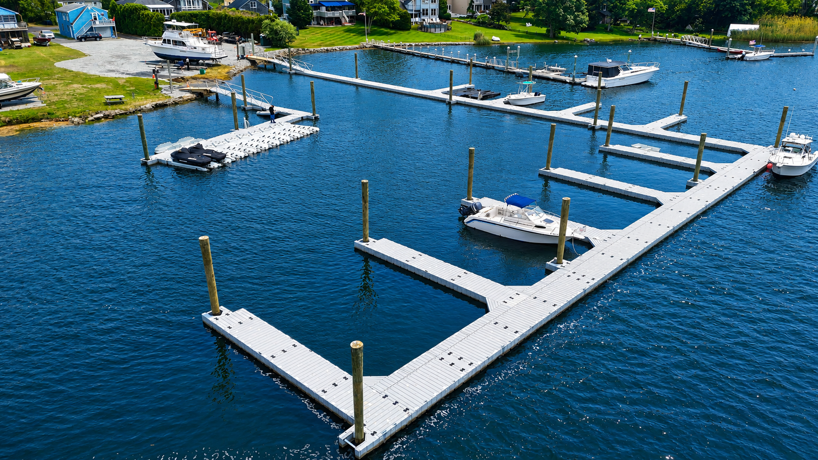 Aerial view of modular floating docks, boat slips and moored boats